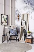 Vintage corner with Windsor chair and wall mirror in front of photo wallpaper