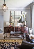 Antique console table and low coffee table in living area