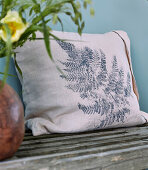 Cushion printed with fern leaf