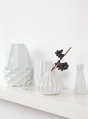 White structured vases on shelf