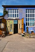 Converted industrial building with vintage-blue façade