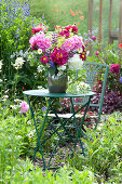 Early summer bouquet on table in the garden