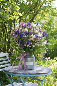 Rural bouquet of Aquilegia and Rubus rods