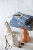 Perforated pottery bells and gifts wrapped in fabric