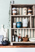 Crockery on open-fronted wooden shelves