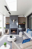 Living terrace with a fireplace and seating