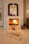 Fire in open fireplace with festive decorations