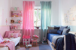 Two-tone children's bedroom half in pink and half in blue