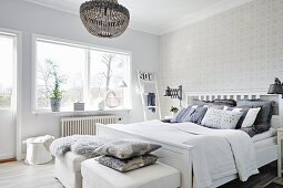 Bright bedroom in white and grey