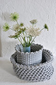 Queen Anne's lace in vase with grey cover