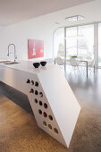 Futurist island counter with integrated wine rack in architect-designed house