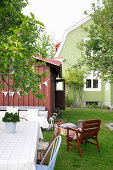 Seating area in Scandinavian summer garden of green house