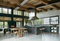Open-plan, industrial-style interior with high ceiling