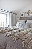Blankets on bed in shades of beige