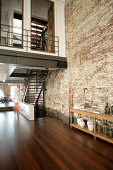 Mezzanine and staircase in industrial building repurposed as home