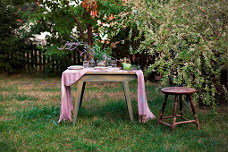 Set table in late-summer garden