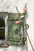 Vintage window shutter decorated with peonies