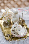 Floral coffee set and posy of roses on gilt tray