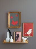 Homemade paper bird silhouettes in picture frames