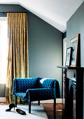 Modern blue armchair with structured velvet cover