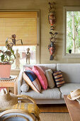 Ethnic accessories in living room in earthy shades