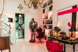 Bust on console table, suit of armour, shelves and antique table in anteroom