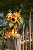 Autumn bouquet of sunflowers and chrysanthemums
