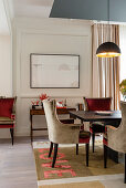 Velvet chairs and panelled walls in luxurious dining room