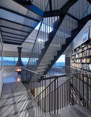 Self-supporting staircase made from perforated metal in modern, architect-designed house