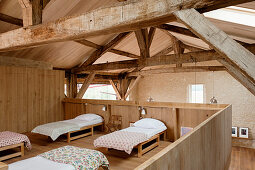 Sleeping area on gallery in converted, renovated barn