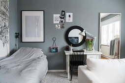 Sofa, desk and bed in teenager's bedroom in grey and white