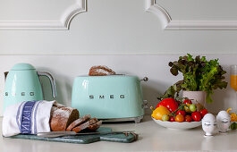 Retro toaster, sliced bread and breakfast ingredients