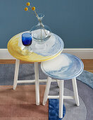 Two round side tables with hand-painted watercolour-effect tops