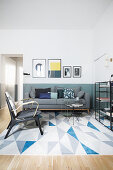 Modern living room in shades of blue with graphic patterns