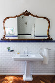 Ornate, antique mirror above vintage-style sink