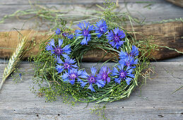 Wreath of grasses and bedstraw with cornflowers
