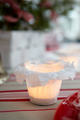 Handmade candle lantern with white tissue-paper cover