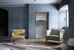 Seating in blue-grey room with wooden floor
