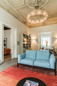 Open-plan living room with stucco ceiling in Wilhelmine-era villa