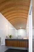 Elegant bathroom with vaulted ceiling
