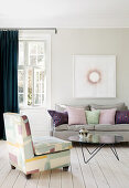 Feminine living room in pastel colours with floorboards