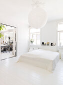 Plain bed in the bedroom with a white floor