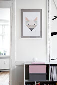 Modern art on white wall above sideboard