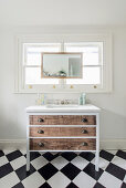 Chest of drawers with undermount sink below window