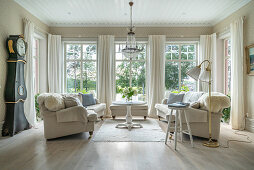 Two sofas facing one another in living room in shades of cream