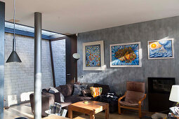 Cosy living area in modern, cubist, architect-designed house with exposed b brickwork and steel column