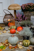 Autumn decoration at the house entrance, wooden mushroom as decoration