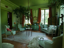 Antique armchairs, sofa and chaise longue in green French parlour