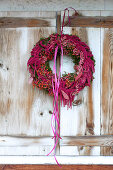 Purple wreath of rose hips, amaranth and ribbons