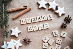 Christmas greeting made from Scrabble tiles, cinnamon stars and star anise